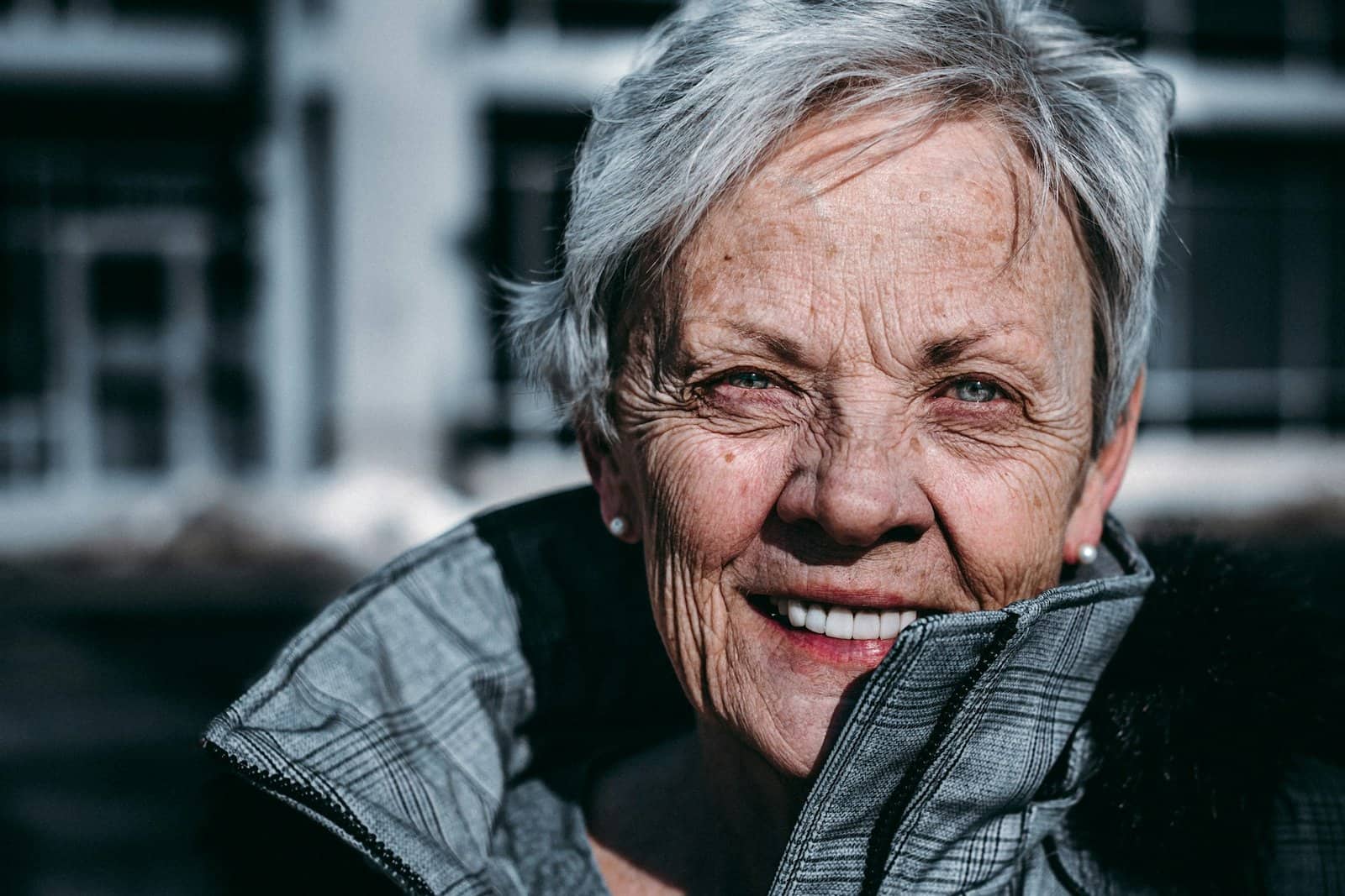 old woman smiling at the camera